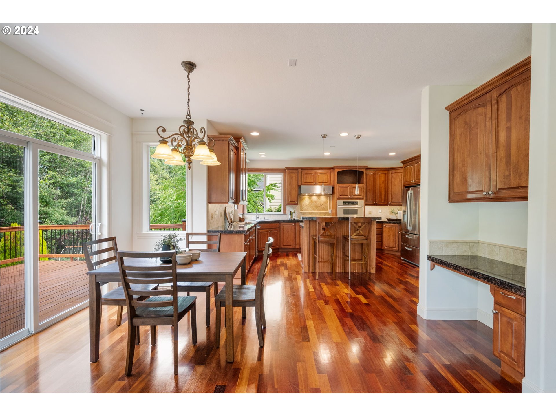 2204 South 17th Way Ridgefield, WA 98642 - Photo 8 of 45 a view of a dining room with furniture wooden floor and chandelier