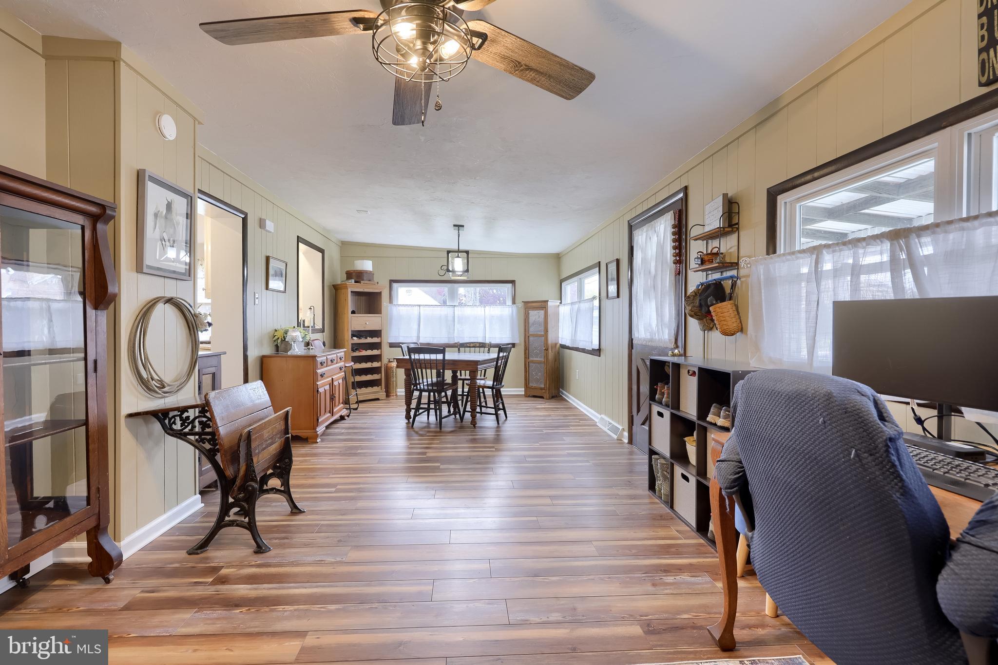2000 Filbert Street York, PA 17404 - Photo 16 of 41 a dining room with wooden floor a chandelier a glass table and chairs