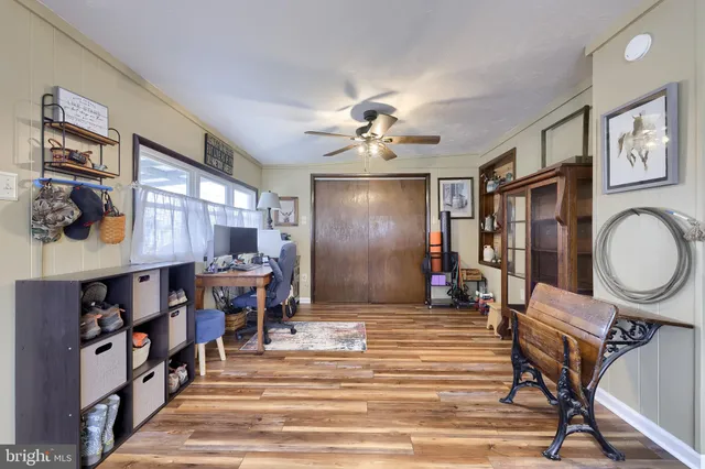 a view of a livingroom with furniture and workspace