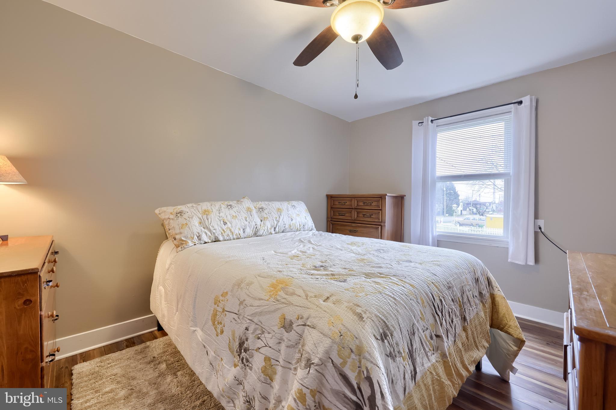 2000 Filbert Street York, PA 17404 - Photo 26 of 41 a bedroom with a large bed and a chandelier