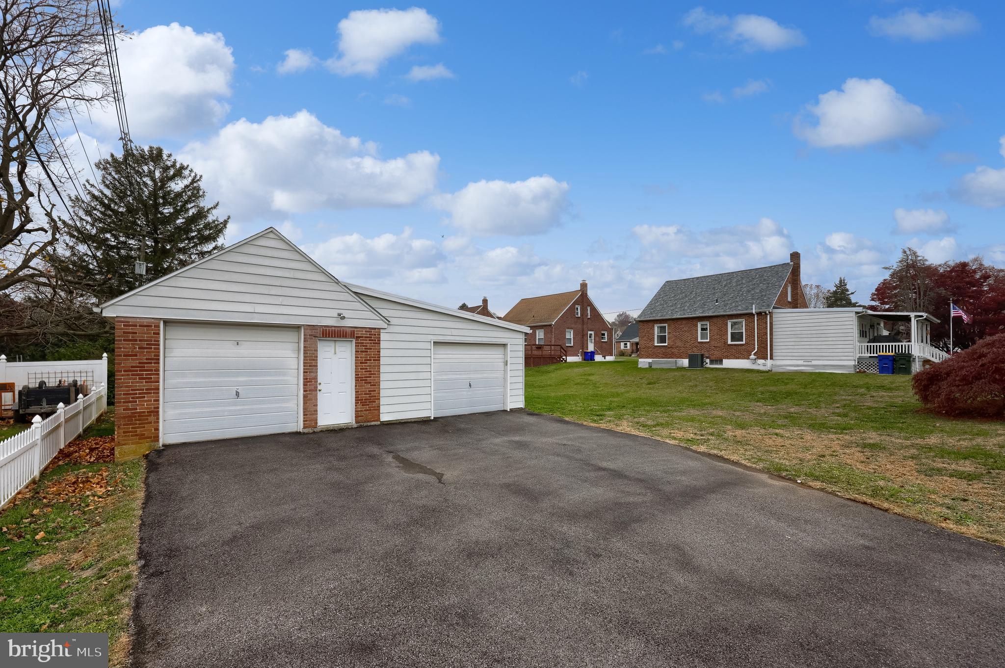 2000 Filbert Street York, PA 17404 - Photo 3 of 41 a front view of a house with a yard and garage