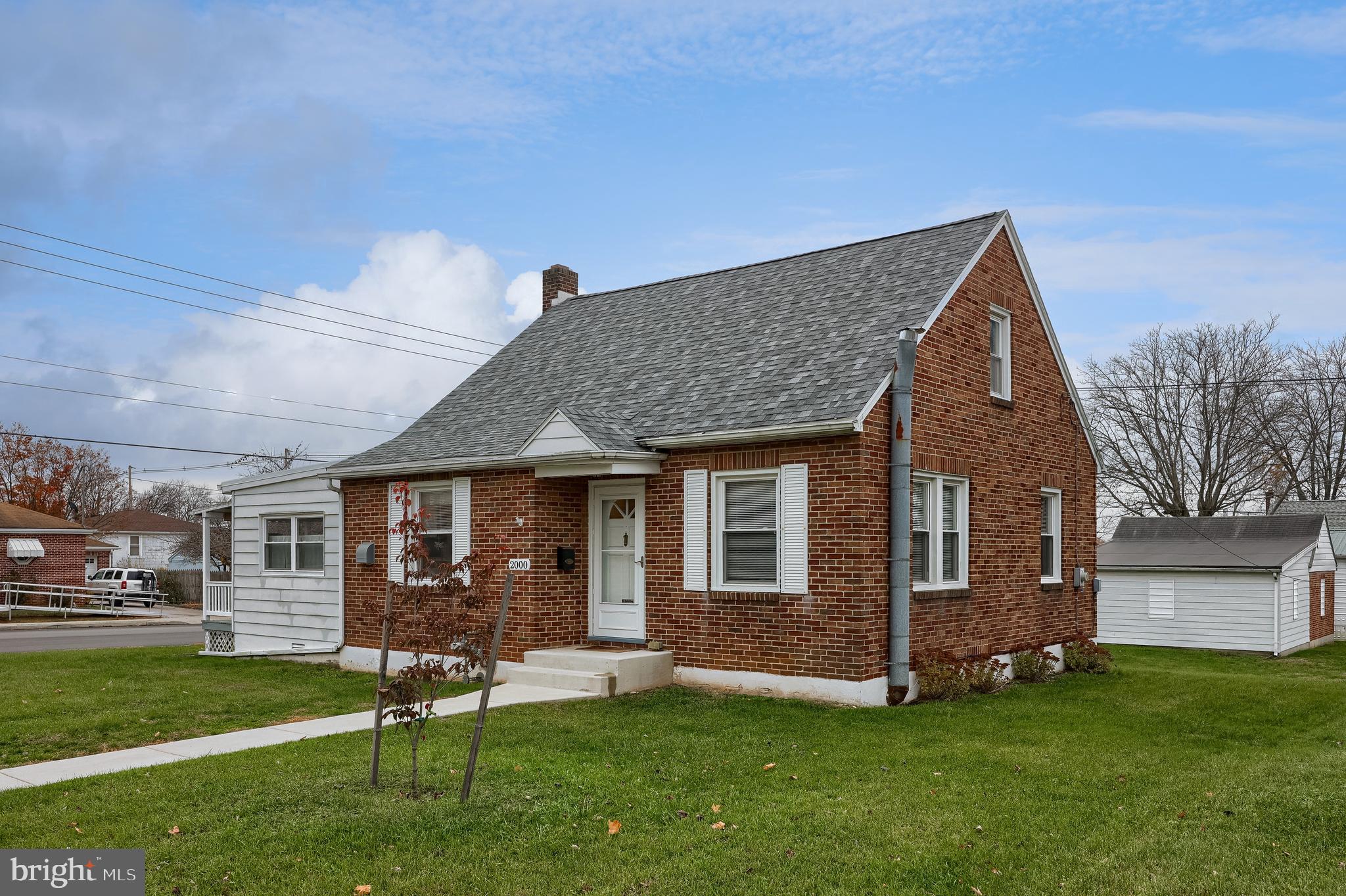 2000 Filbert Street York, PA 17404 - Photo 32 of 41 a front view of a house with a garden and yard