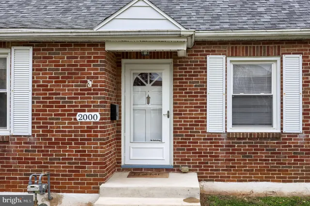 a front view of a house with a white door