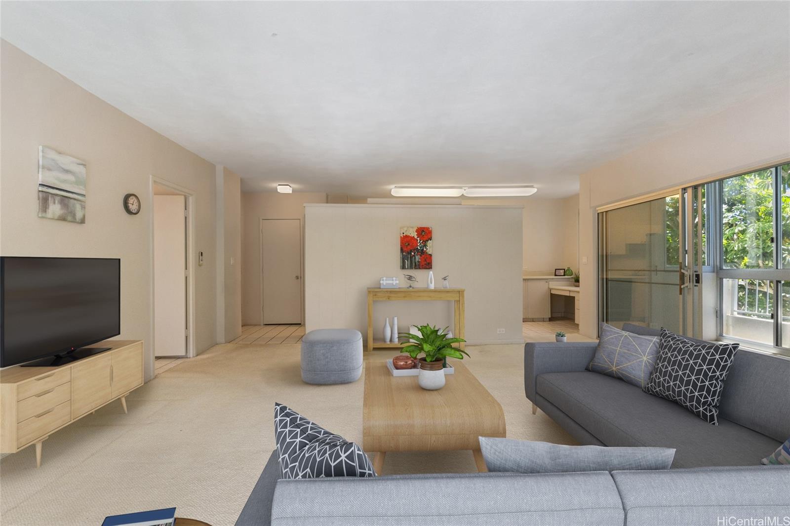 a living room with furniture and a flat screen tv