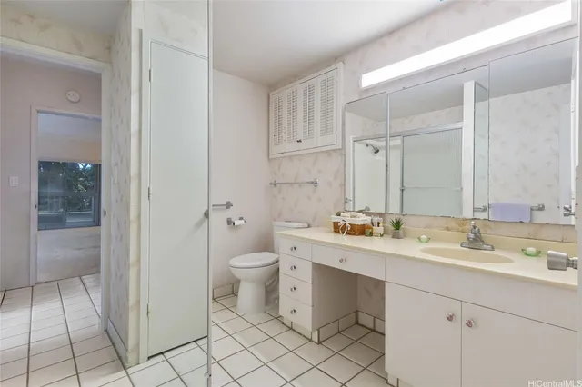 a view of a bathroom from a hallway