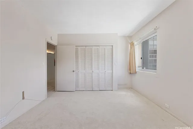 a view of multi story residential apartment building with a yard