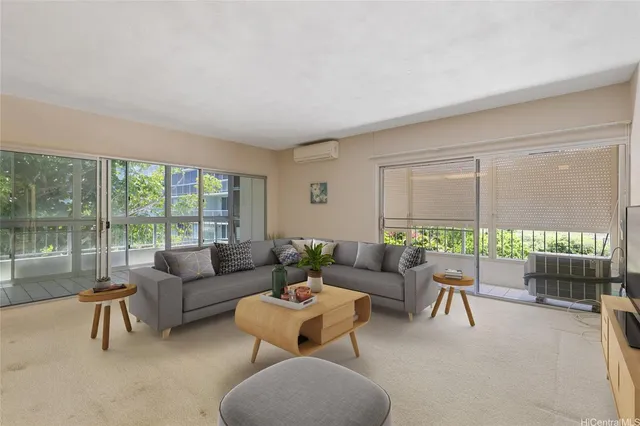 a living room with furniture and a large window