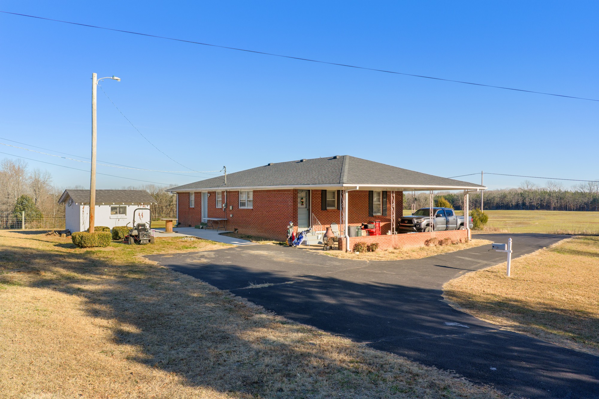 2095 Bible Hill Road Parsons, TN 38363 - Photo 1 of 20 a view of a house with swimming pool
