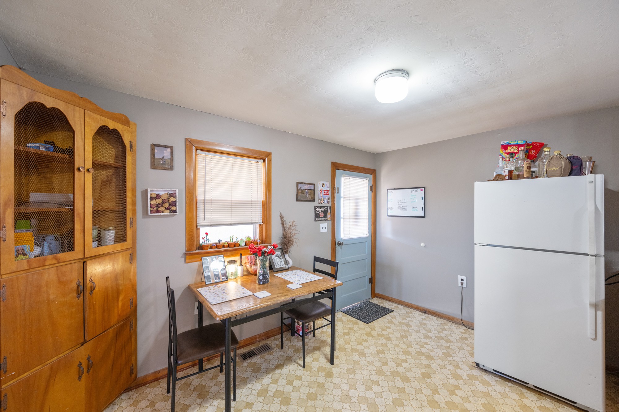 2095 Bible Hill Road Parsons, TN 38363 - Photo 13 of 20 a living room with a couch and a refrigerator