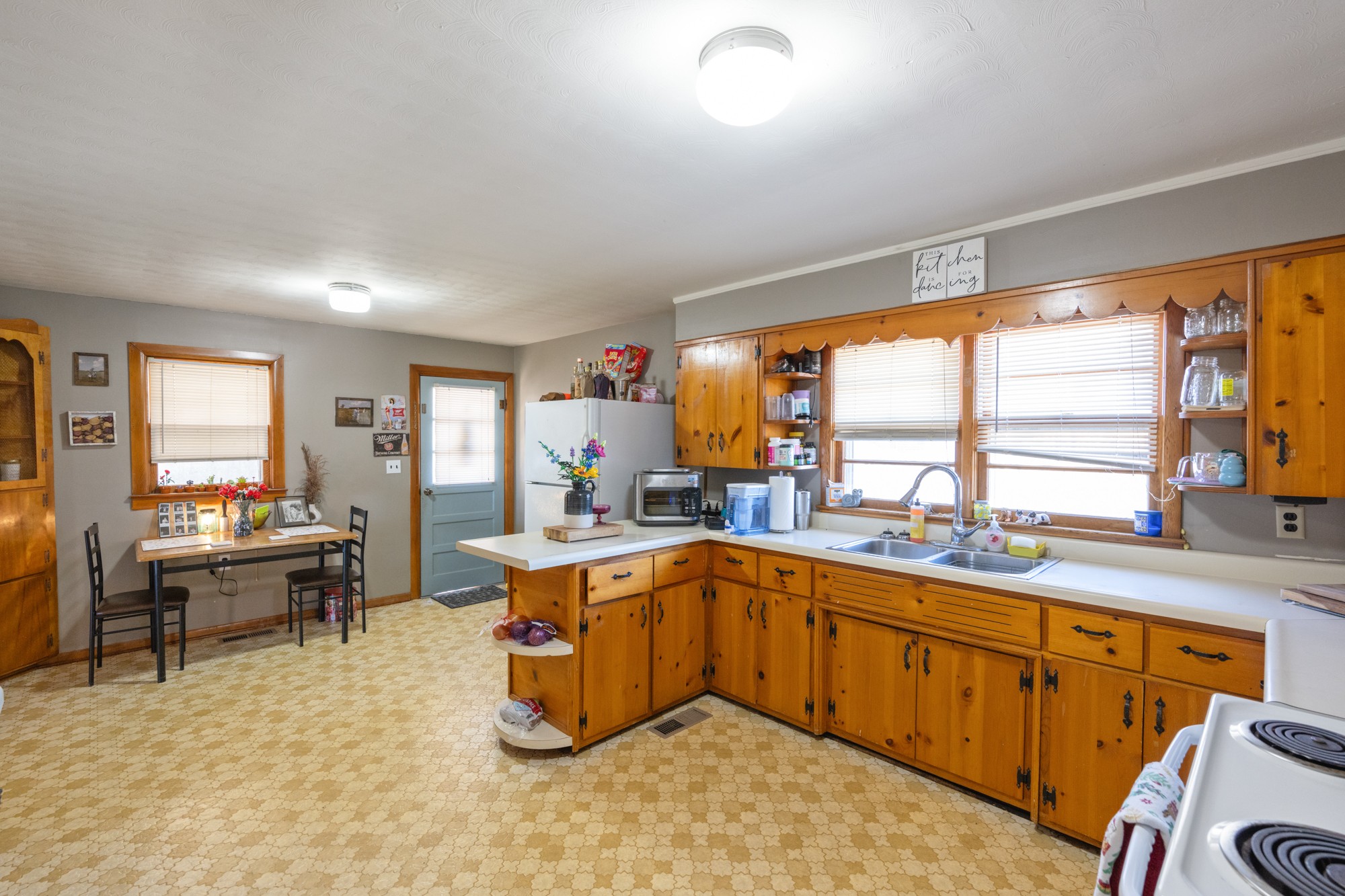 2095 Bible Hill Road Parsons, TN 38363 - Photo 15 of 20 a kitchen with a sink stove and cabinets