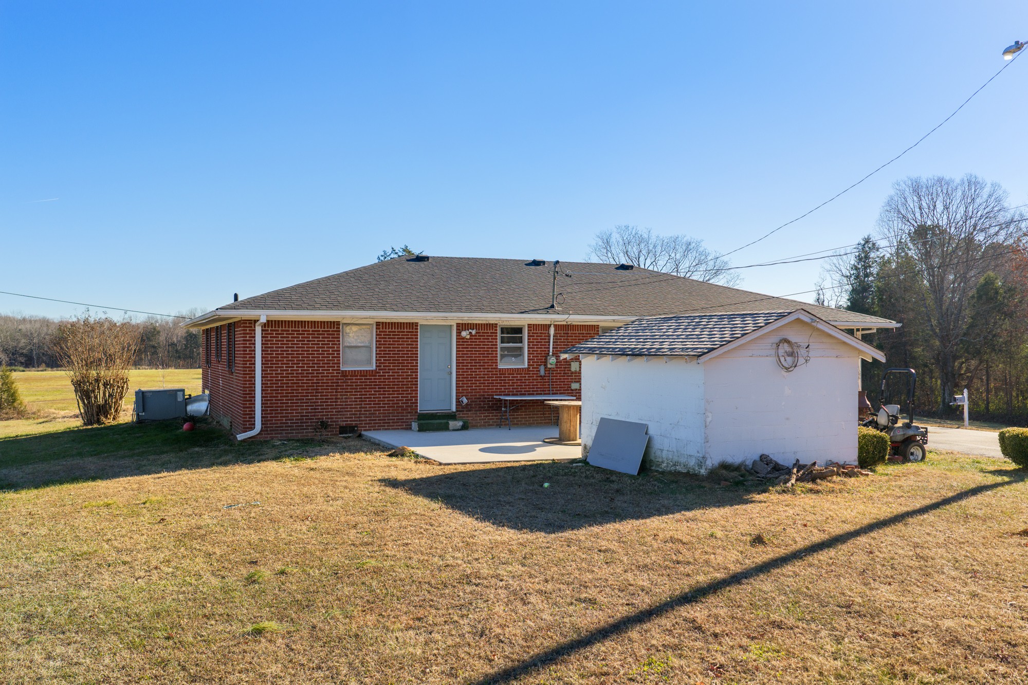 2095 Bible Hill Road Parsons, TN 38363 - Photo 4 of 20 a front view of a house with a yard