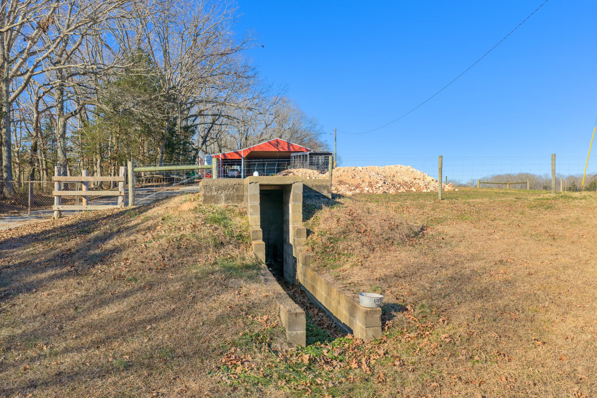 2095 Bible Hill Road Parsons, TN 38363 - Photo 5 of 20 a yellow house with trees in front of it