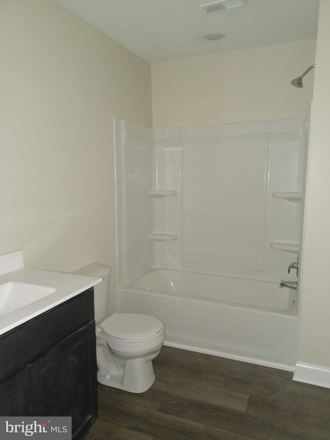 302 North Kent Street Winchester, VA 22601 - Photo 3 of 11 a bathroom with a toilet a sink and shower