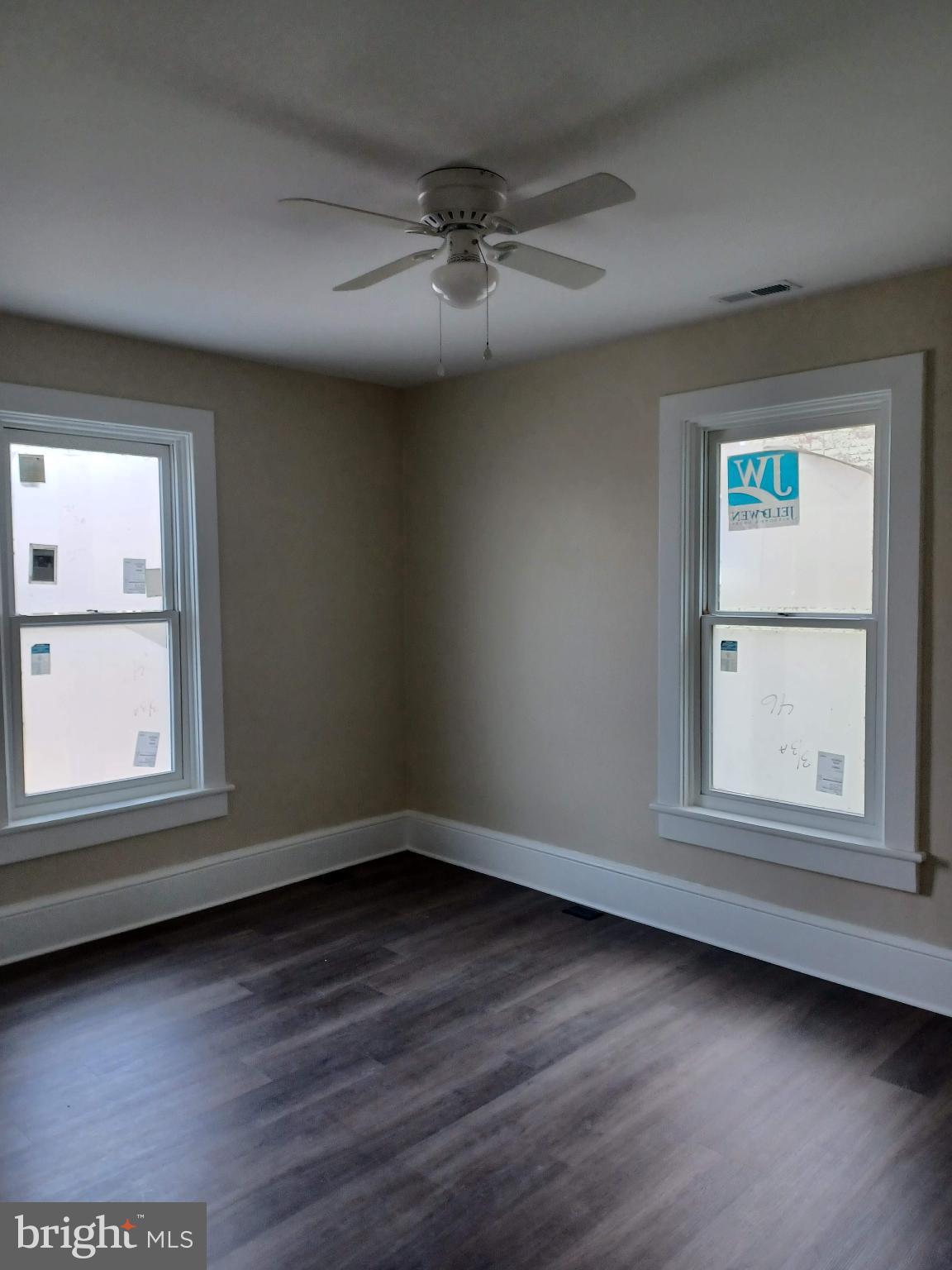 302 North Kent Street Winchester, VA 22601 - Photo 6 of 11 an empty room with wooden floor and windows