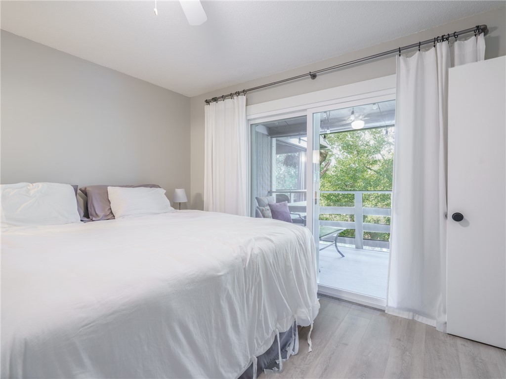 2328 Sadler Road, Unit 1E Fernandina Beach, FL 32034 - Photo 13 of 31 a bedroom with a bed and a window