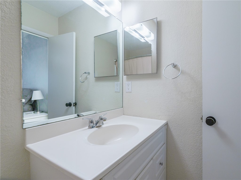 2328 Sadler Road, Unit 1E Fernandina Beach, FL 32034 - Photo 15 of 31 a bathroom with a sink and a mirror