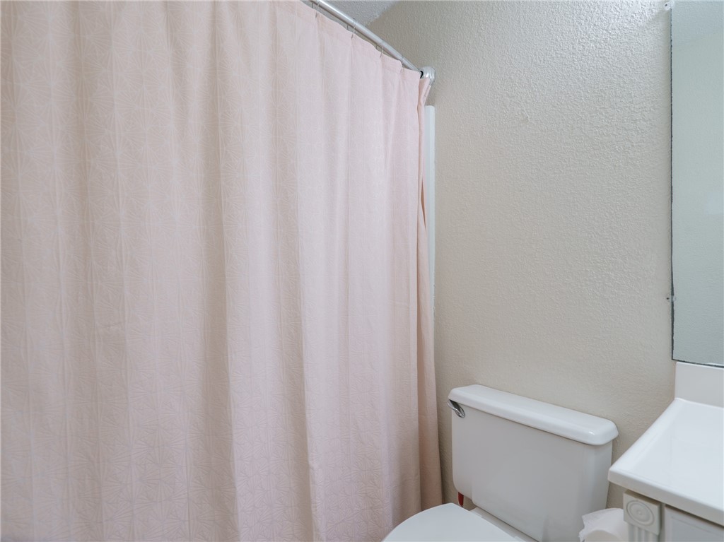 2328 Sadler Road, Unit 1E Fernandina Beach, FL 32034 - Photo 16 of 31 a white toilet sitting next to a shower