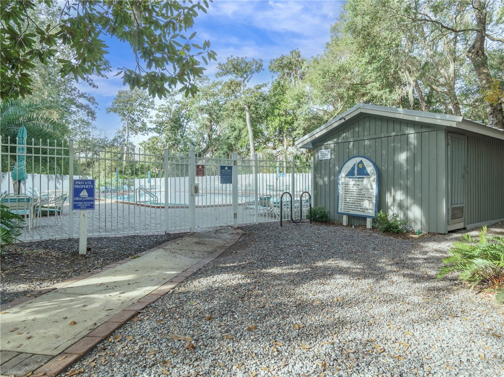 2328 Sadler Road, Unit 1E Fernandina Beach, FL 32034 - Photo 20 of 31 a backyard of a house with lots of green space