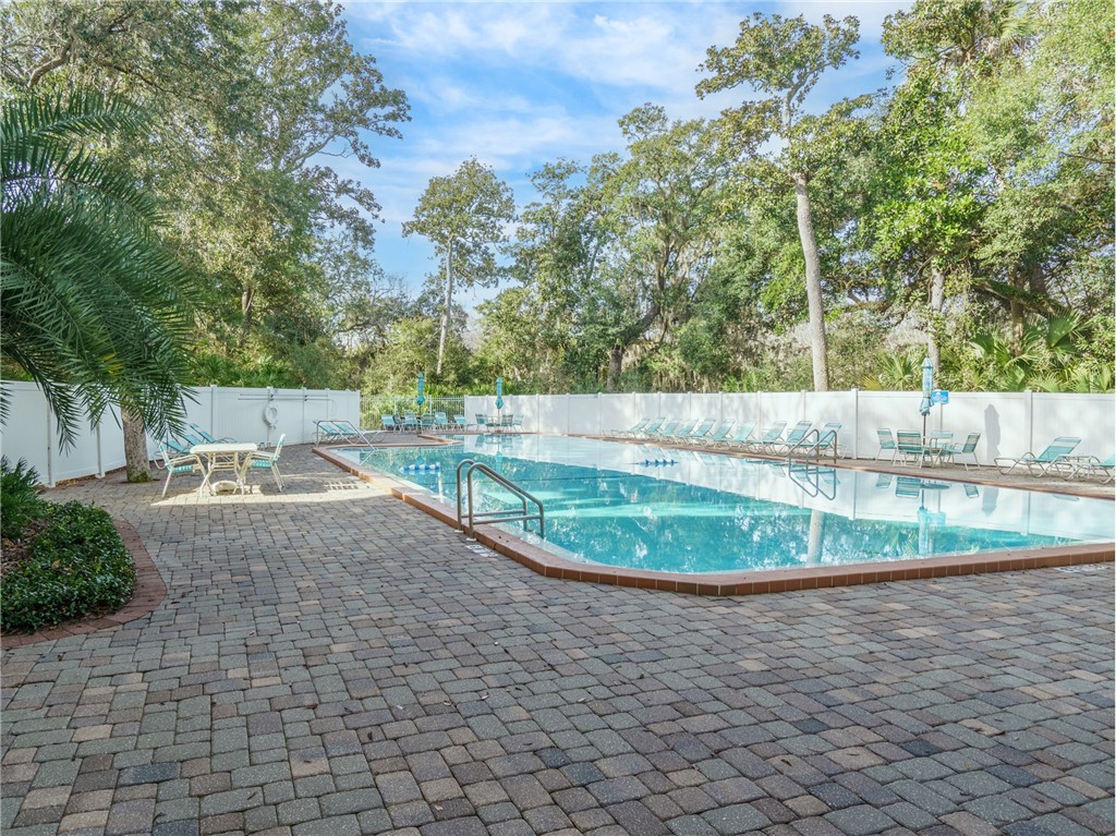 2328 Sadler Road, Unit 1E Fernandina Beach, FL 32034 - Photo 21 of 31 a view of a swimming pool with a yard