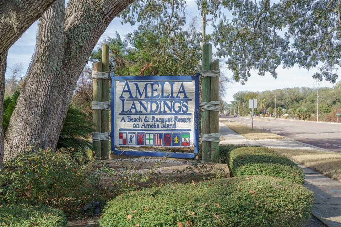 2328 Sadler Road, Unit 1E Fernandina Beach, FL 32034 - Photo 28 of 31 a sign on the side of a road