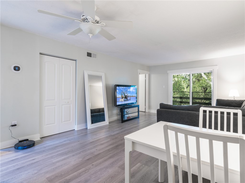 2328 Sadler Road, Unit 1E Fernandina Beach, FL 32034 - Photo 4 of 31 a living room with furniture and a window