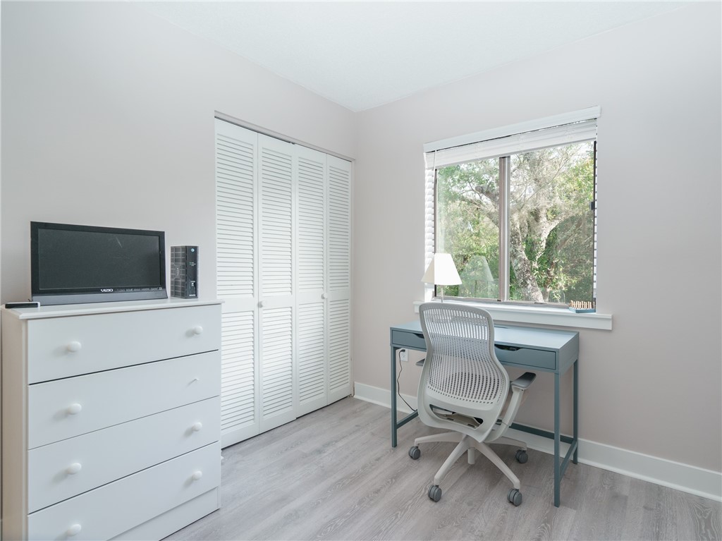 2328 Sadler Road, Unit 1E Fernandina Beach, FL 32034 - Photo 10 of 31 a view of a workspace with furniture and a window