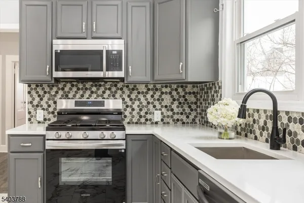 a kitchen with a sink and a stove