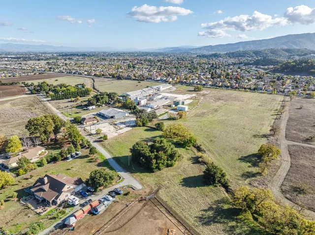 an aerial view of a residential houses with outdoor space