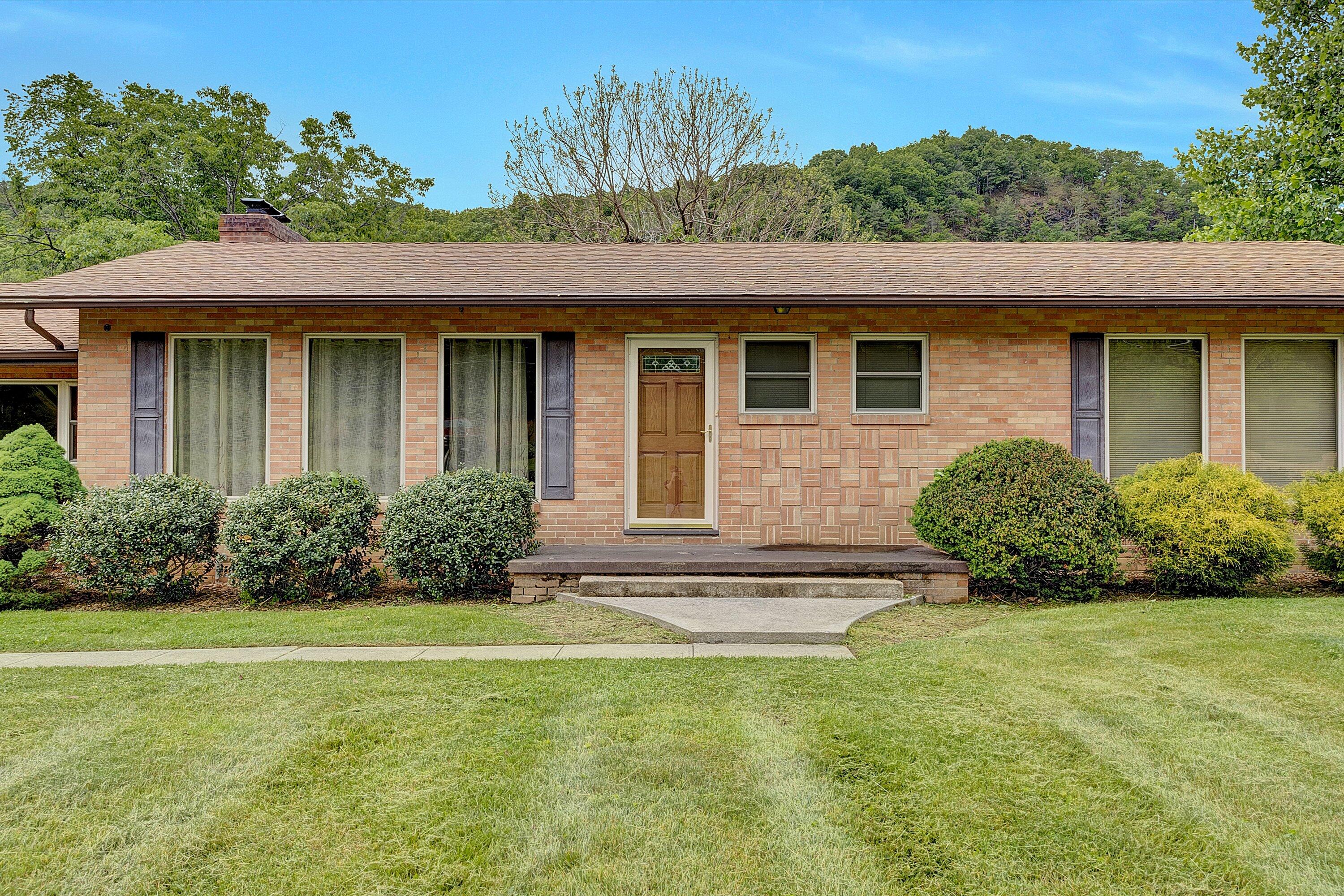 2015 Evergreen Road Covington, VA 24426 - Photo 5 of 46 a front view of a house with garden
