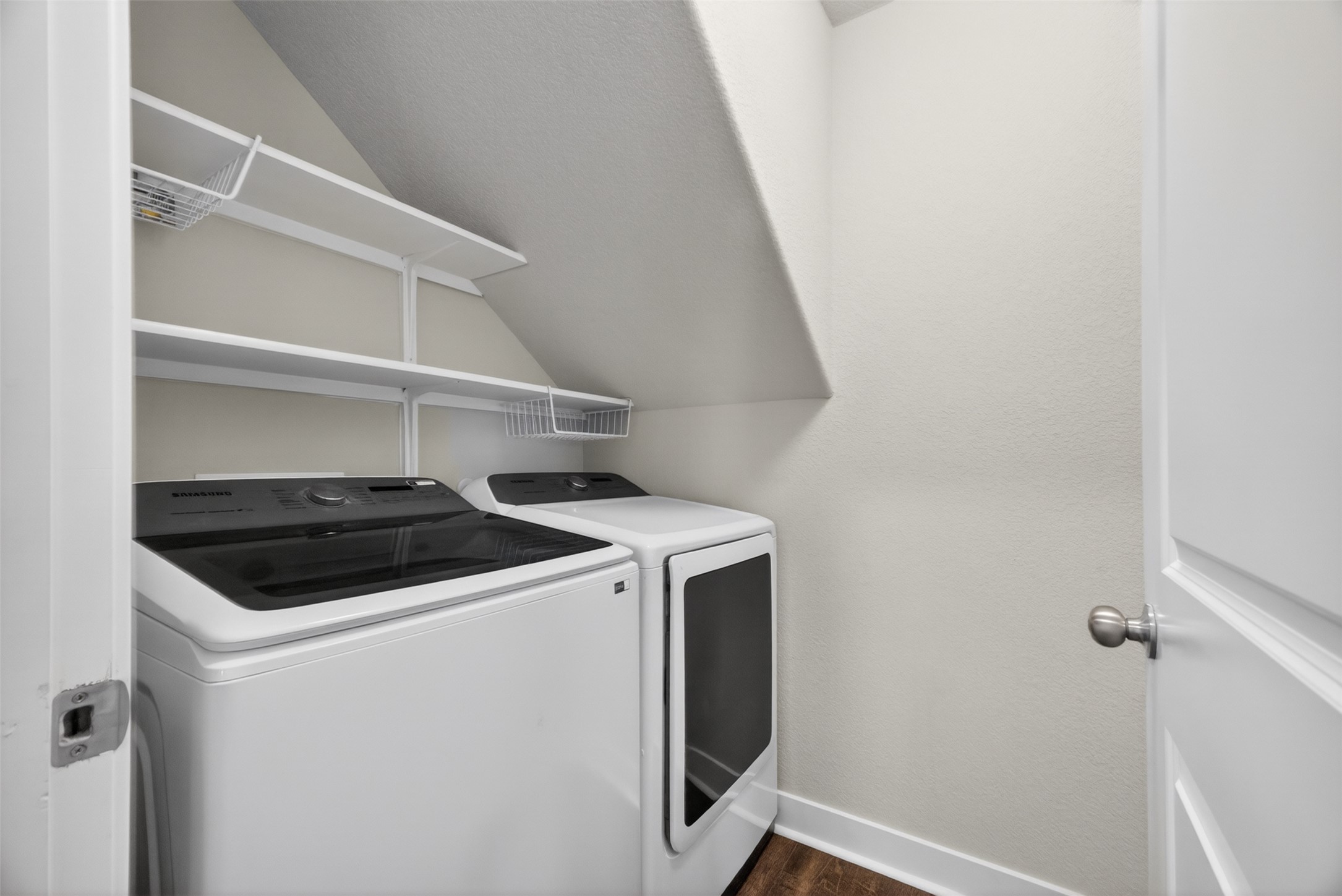 1009 Bright Star Cove Georgetown, TX 78628 - Photo 17 of 40 a view of storage and utility room with washer and dryer