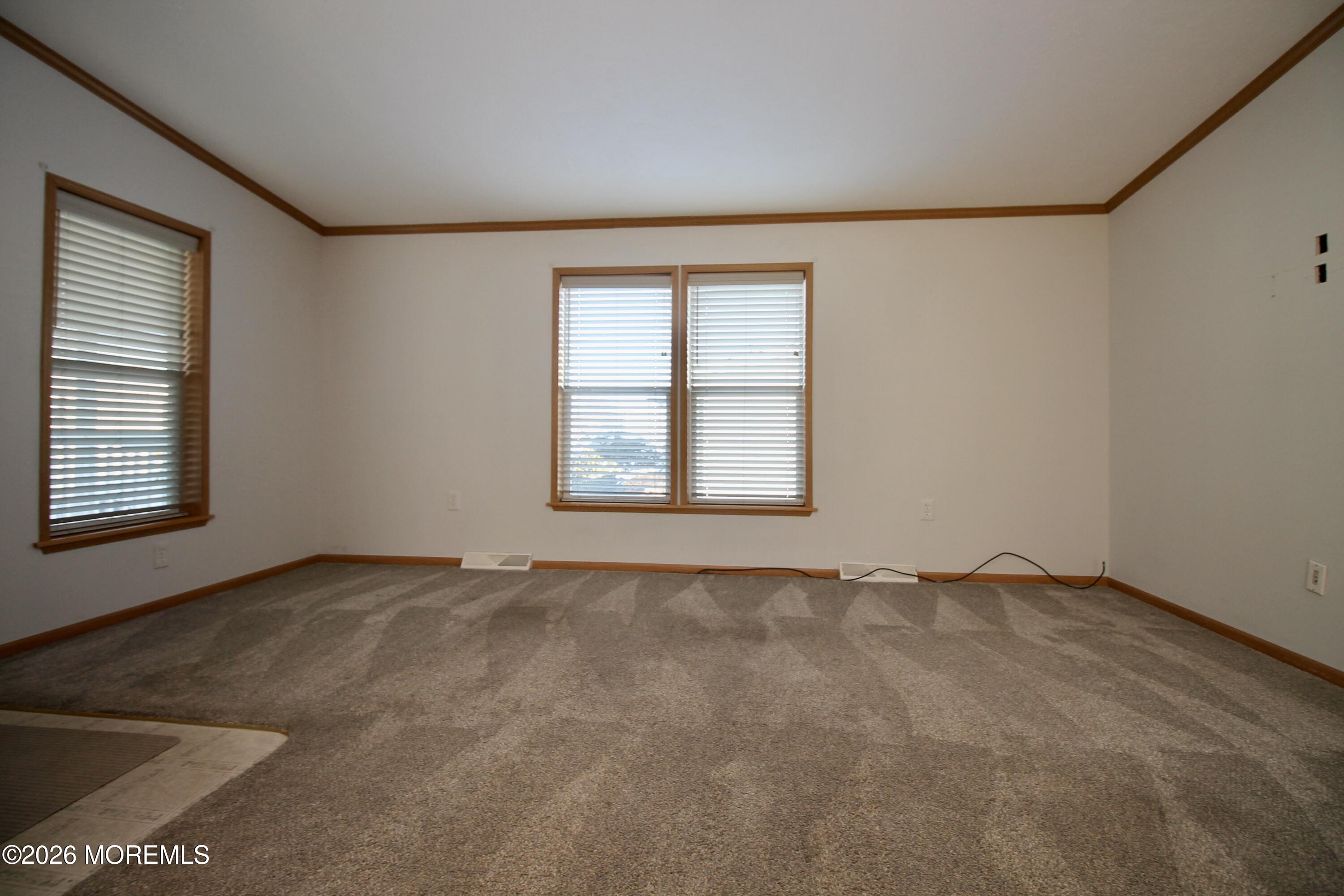 75 Robin Place Freehold, NJ 07728 - Photo 11 of 36 an empty room with a window
