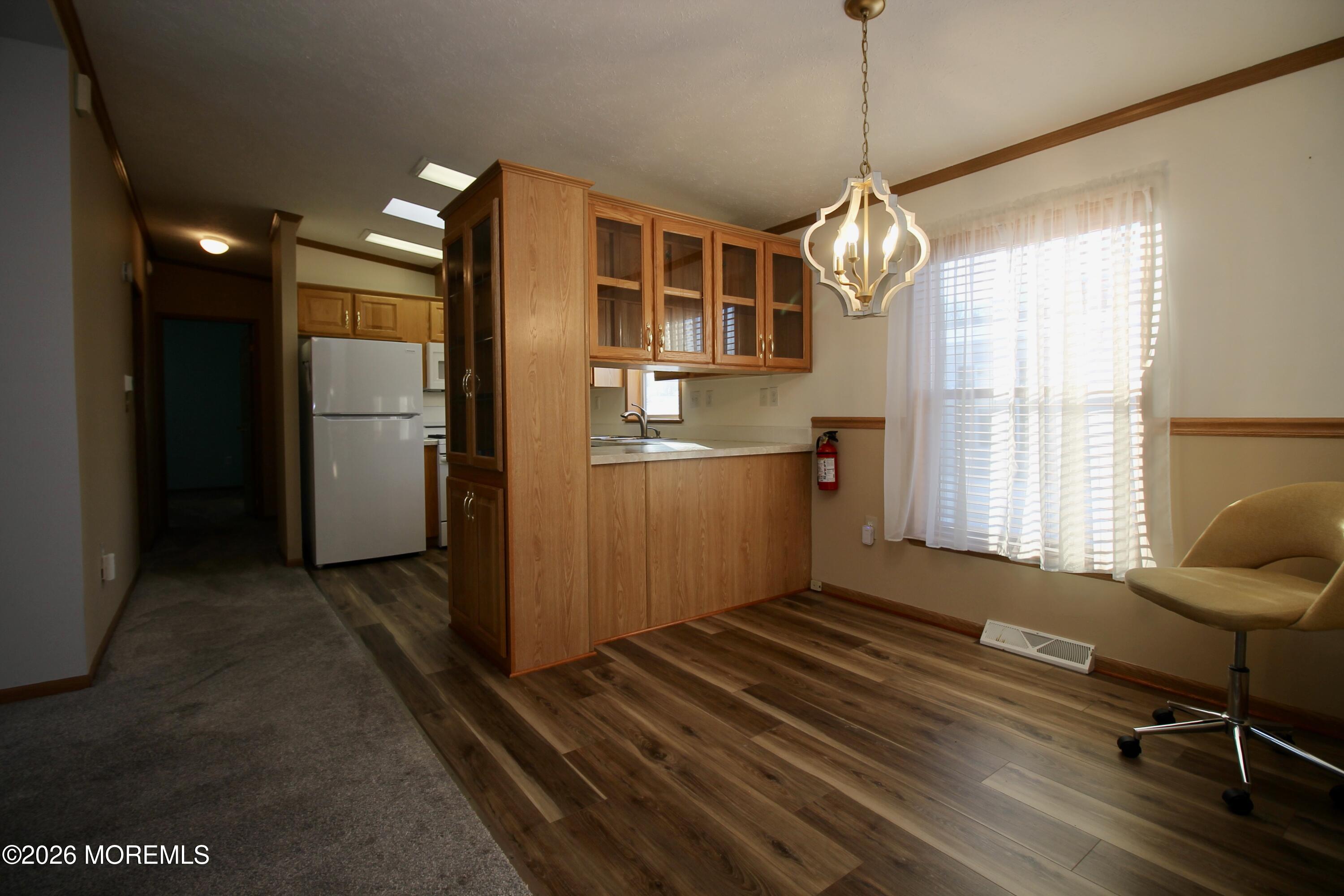 75 Robin Place Freehold, NJ 07728 - Photo 14 of 36 a kitchen with refrigerator and windows