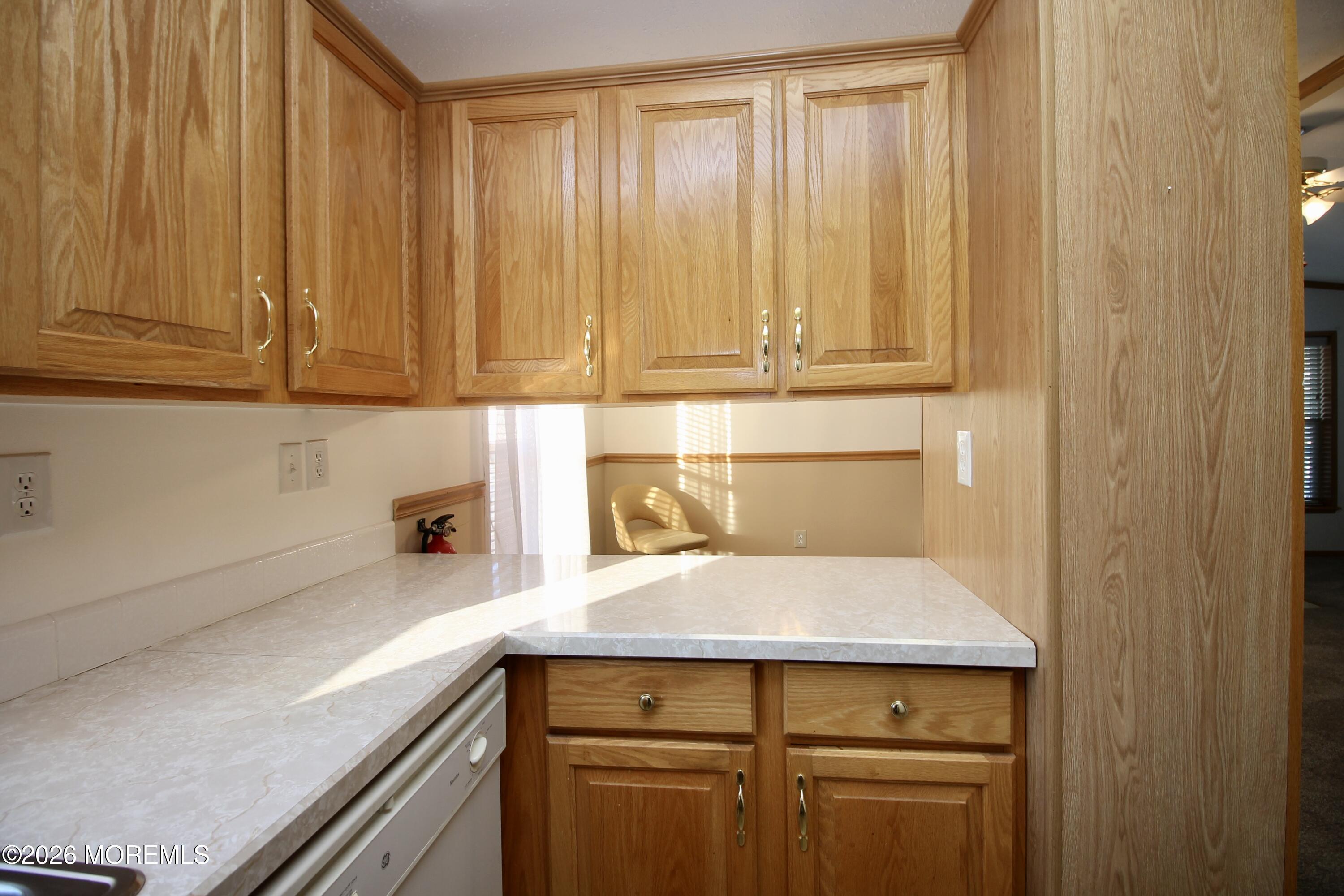 75 Robin Place Freehold, NJ 07728 - Photo 18 of 36 a kitchen with a sink and cabinets