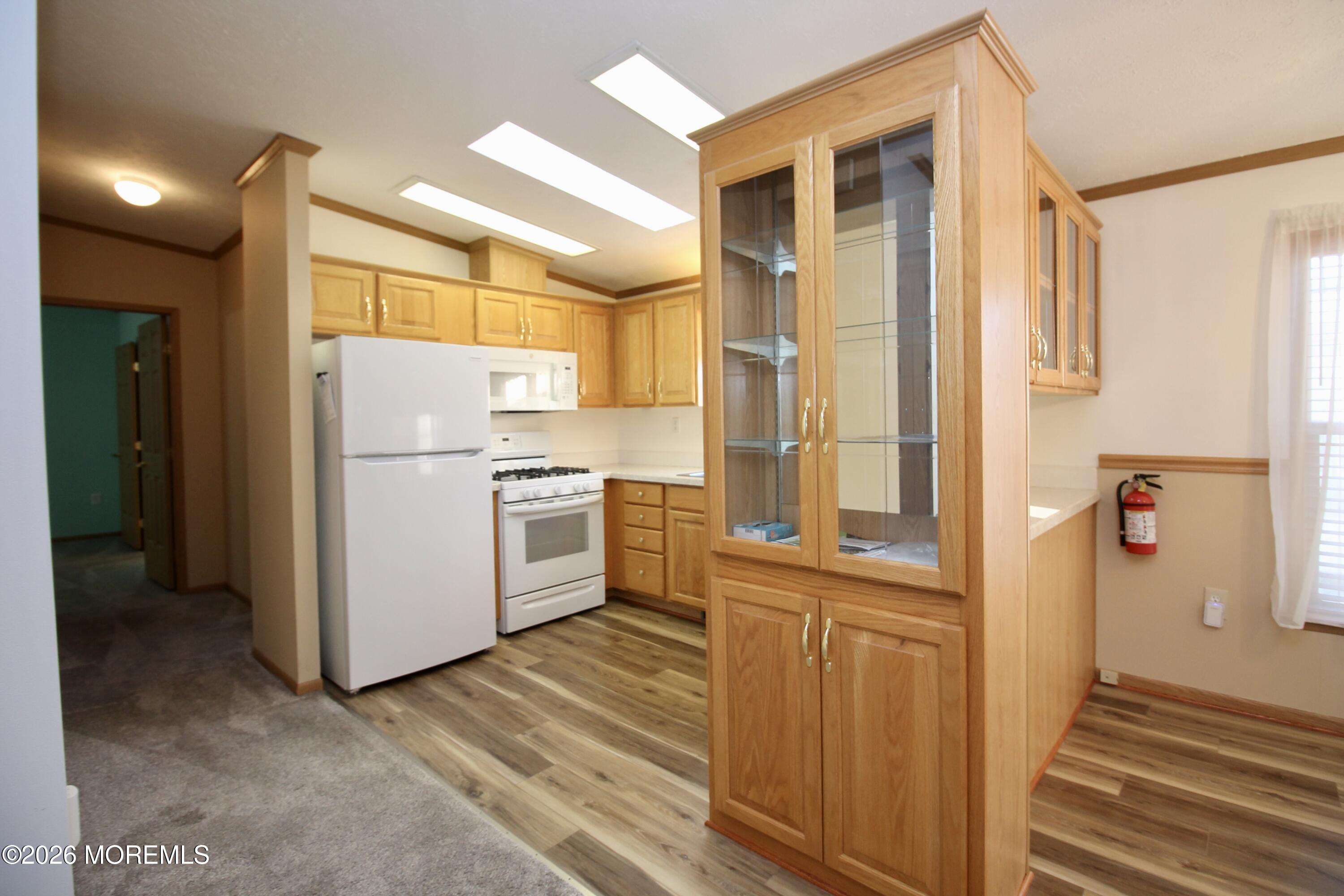 75 Robin Place Freehold, NJ 07728 - Photo 20 of 36 a kitchen with a refrigerator a washer and dryer