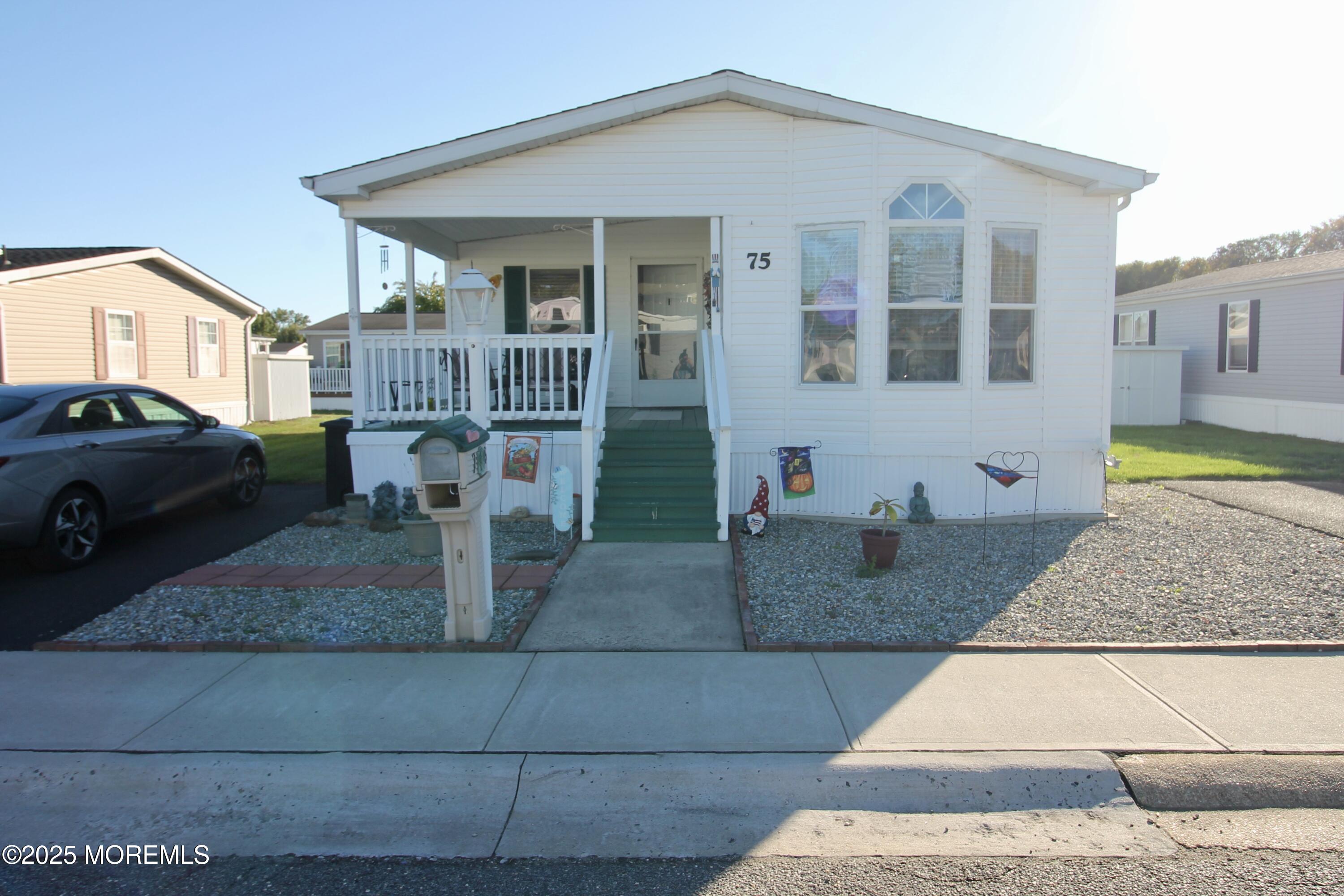 75 Robin Place Freehold, NJ 07728 - Photo 2 of 36 a front view of a house with garden