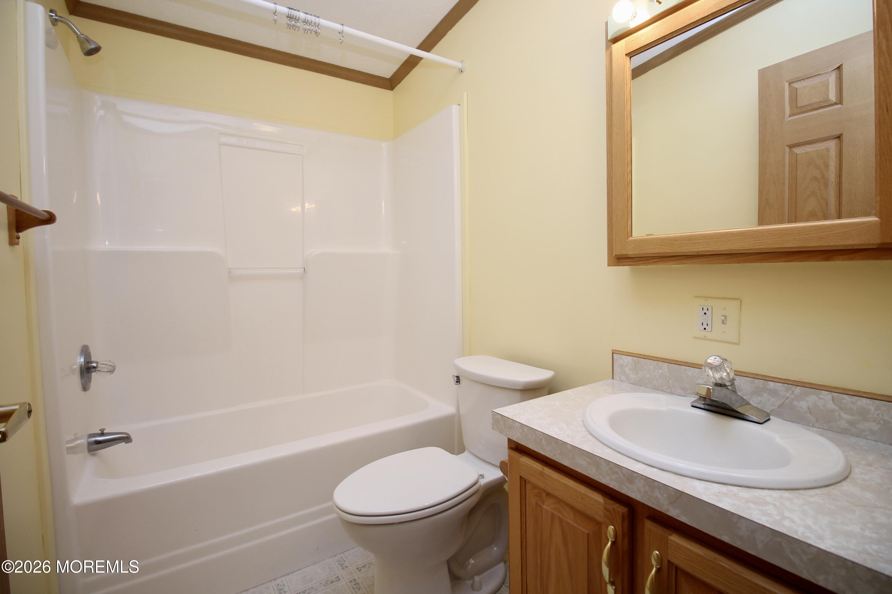 75 Robin Place Freehold, NJ 07728 - Photo 21 of 36 a bathroom with a sink a toilet and shower