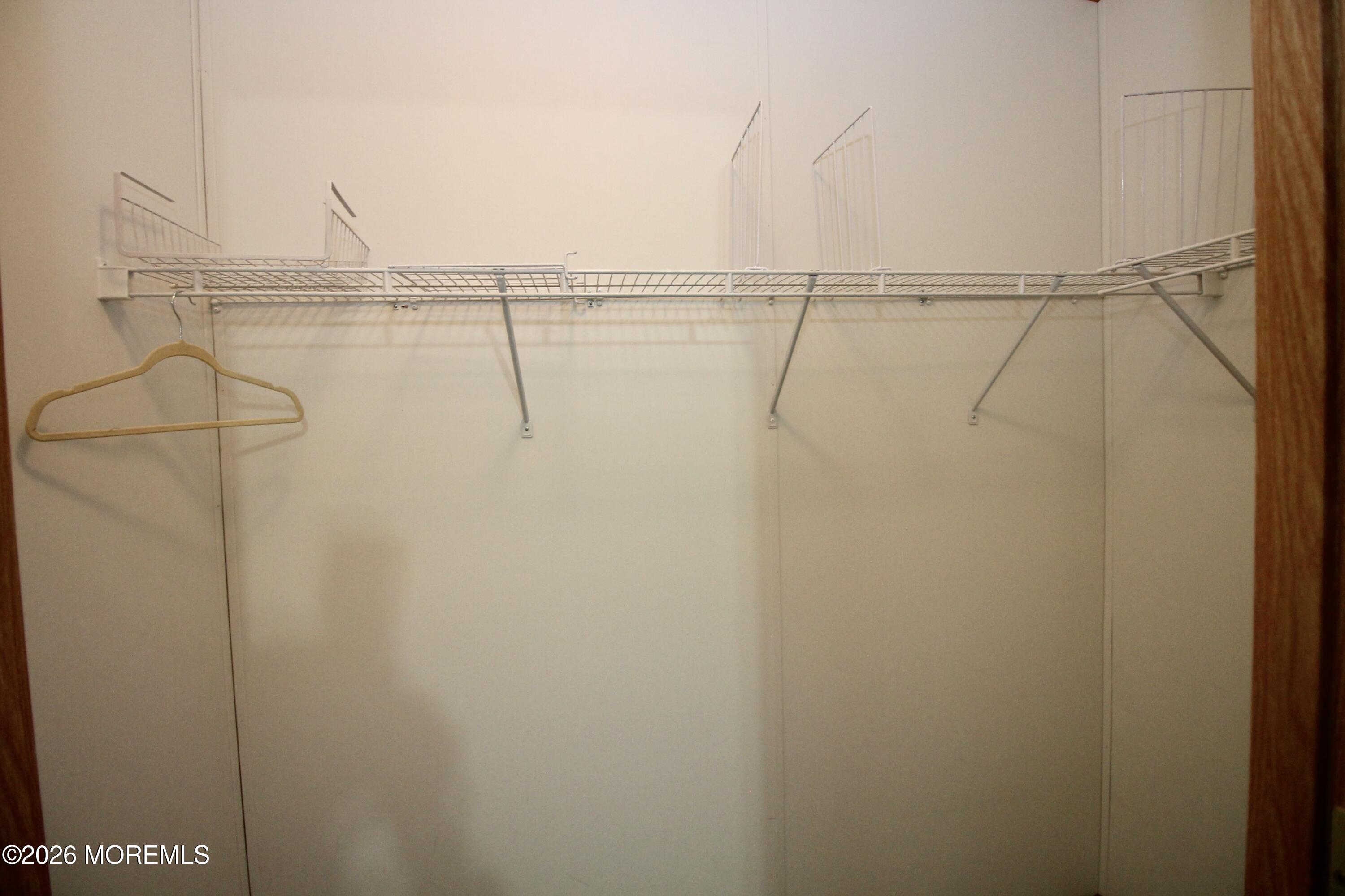 75 Robin Place Freehold, NJ 07728 - Photo 27 of 36 a view of small space with racks on the wall