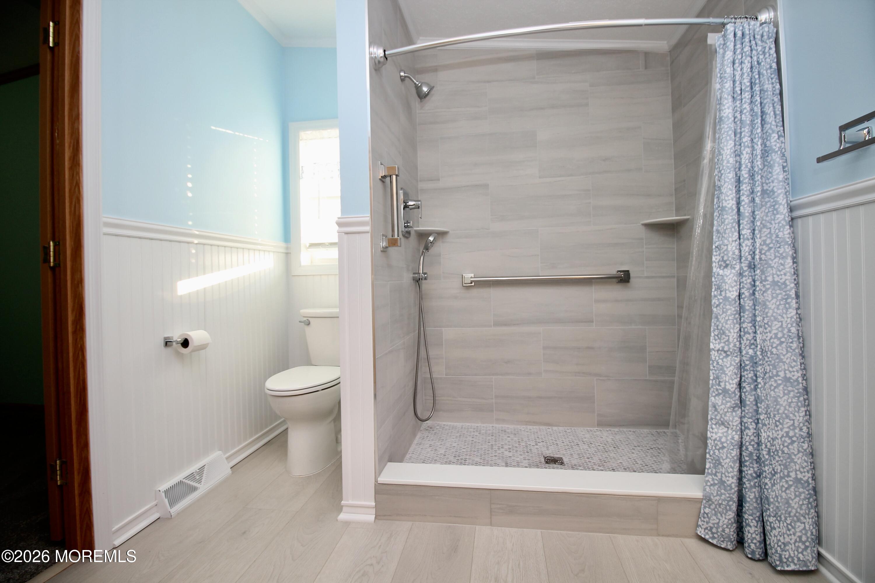 75 Robin Place Freehold, NJ 07728 - Photo 29 of 36 a bathroom with a shower and a toilet