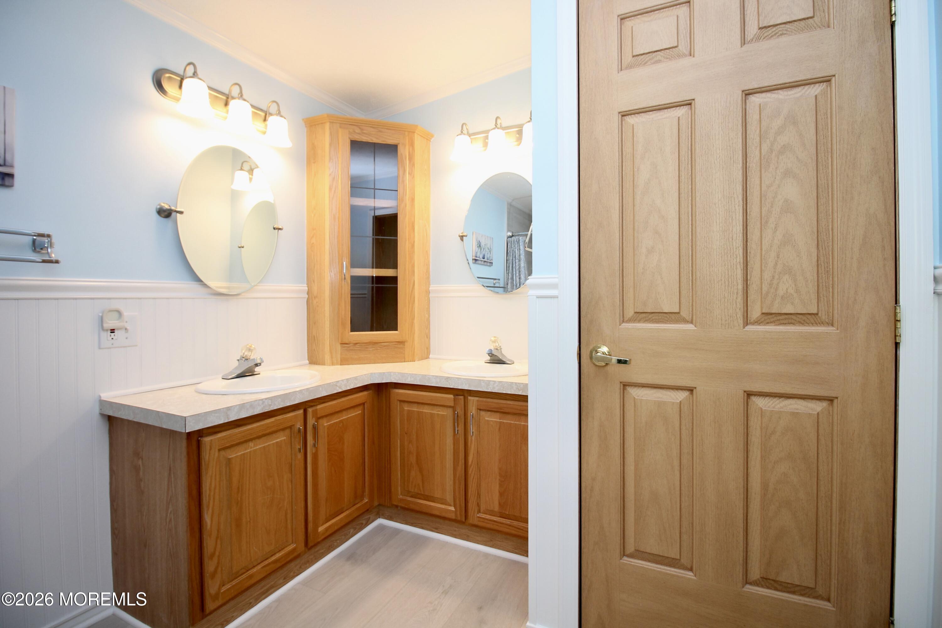 75 Robin Place Freehold, NJ 07728 - Photo 31 of 36 a bathroom with a sink and a mirror