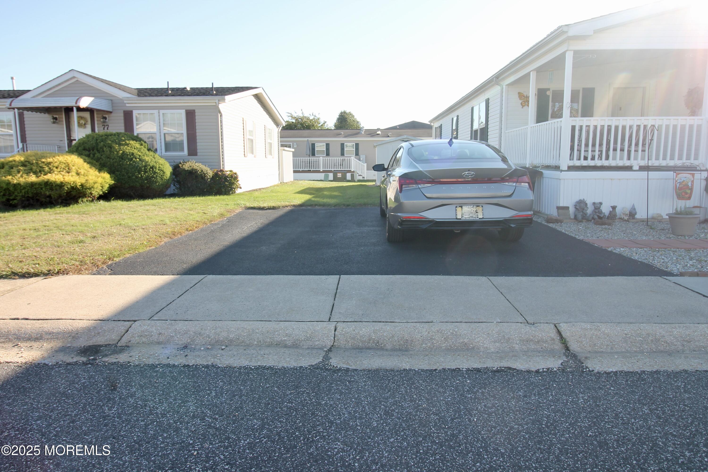 75 Robin Place Freehold, NJ 07728 - Photo 4 of 36 a front view of a house with a yard