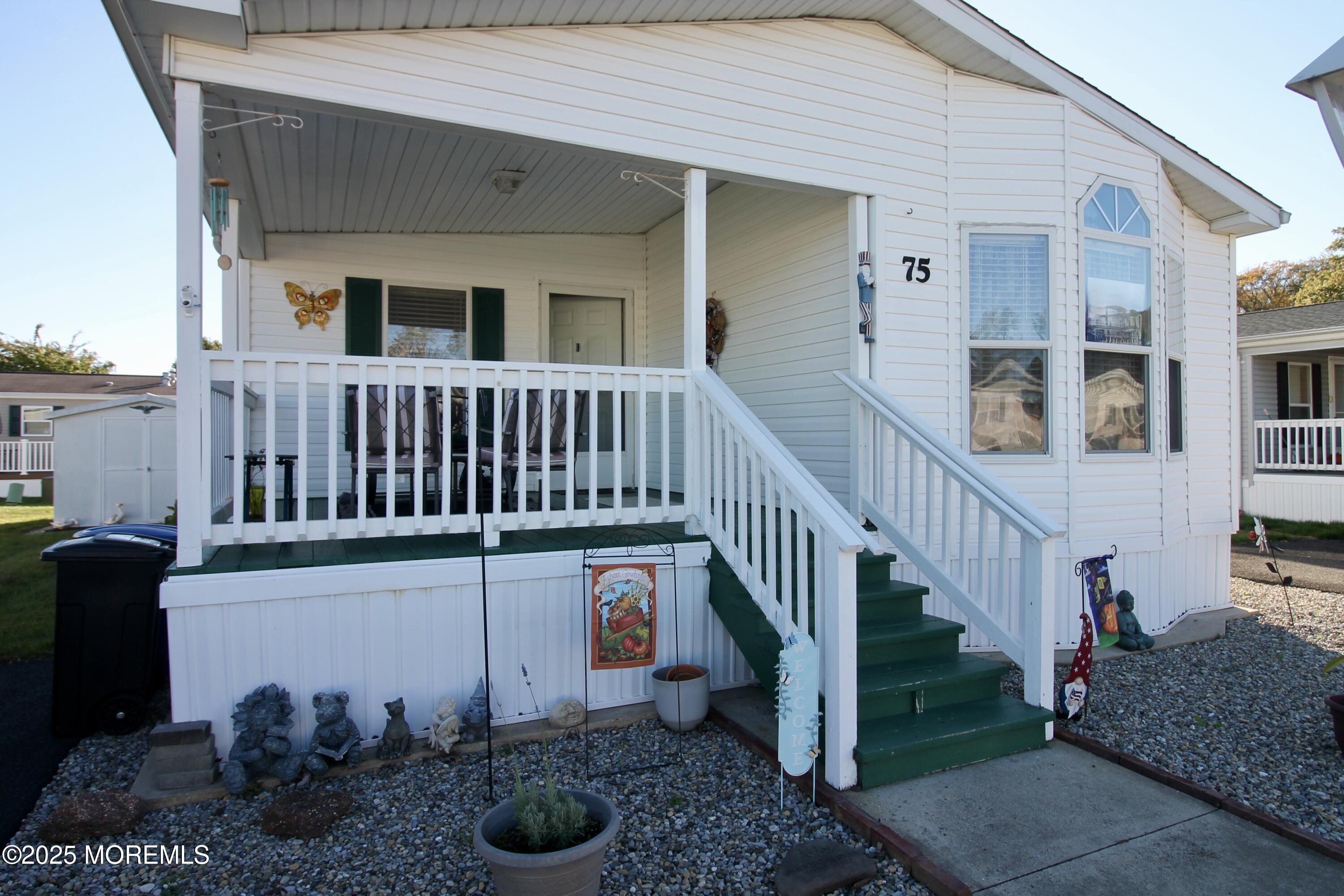 75 Robin Place Freehold, NJ 07728 - Photo 5 of 36 a view of a house with backyard and furniture