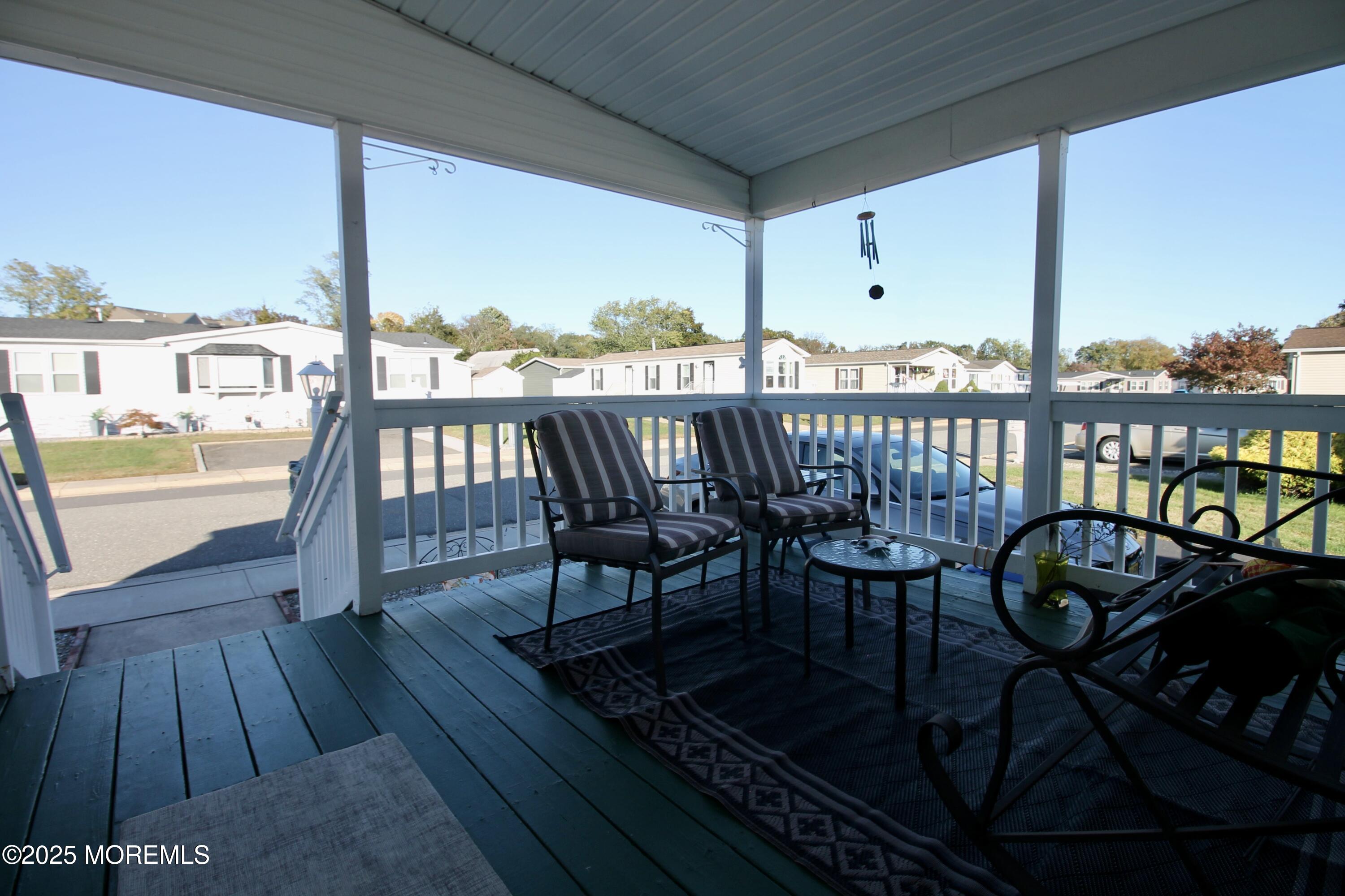 75 Robin Place Freehold, NJ 07728 - Photo 7 of 36 an outdoor view from balcony with seating space
