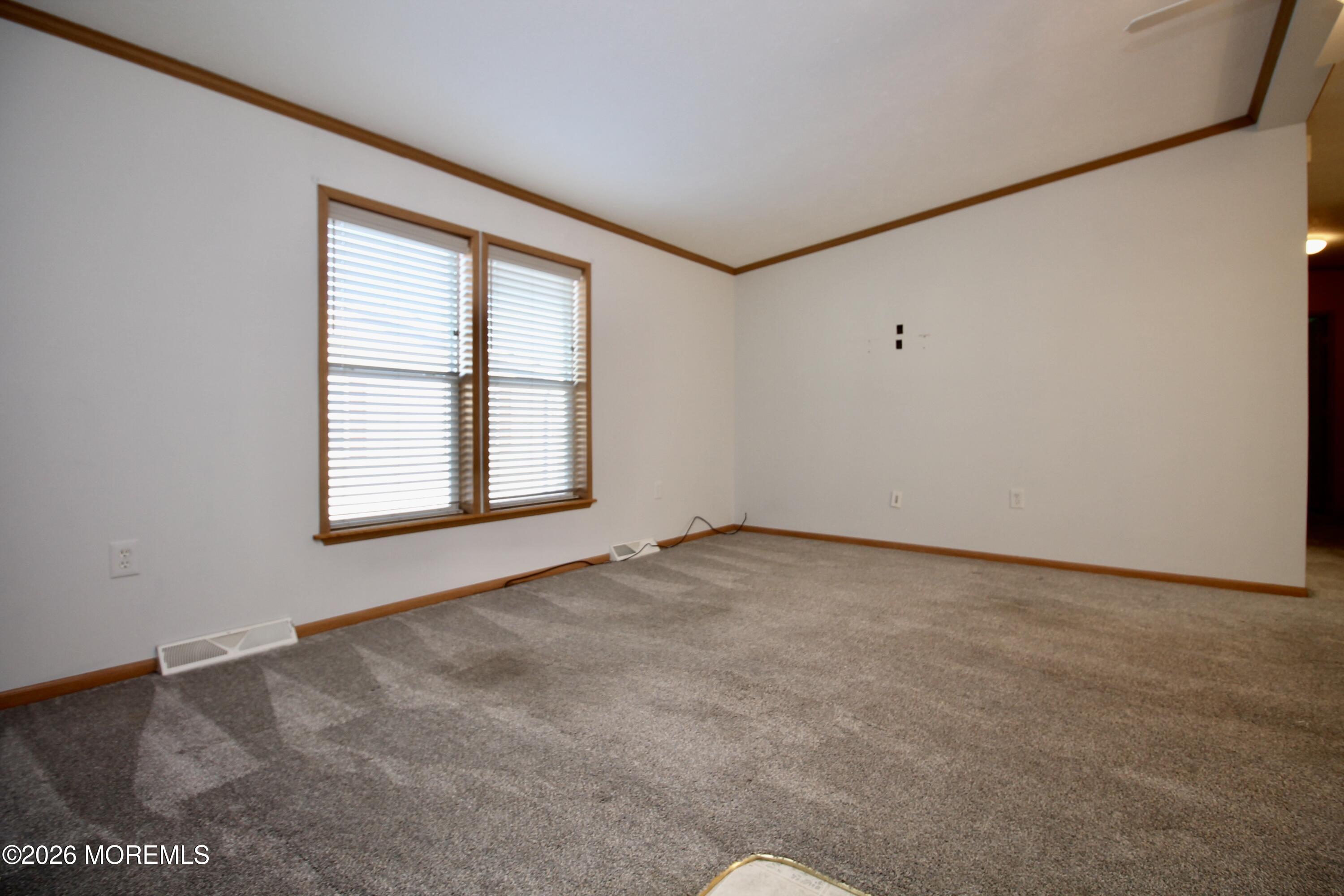 75 Robin Place Freehold, NJ 07728 - Photo 9 of 36 an empty room with a window