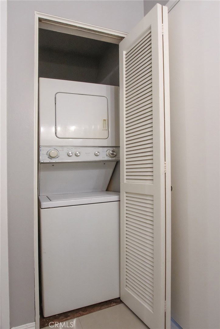 12640 Briarglen Loop, Unit F Stanton, CA 90680 - Photo 22 of 24 Laundry closet with stackable washer and dryer