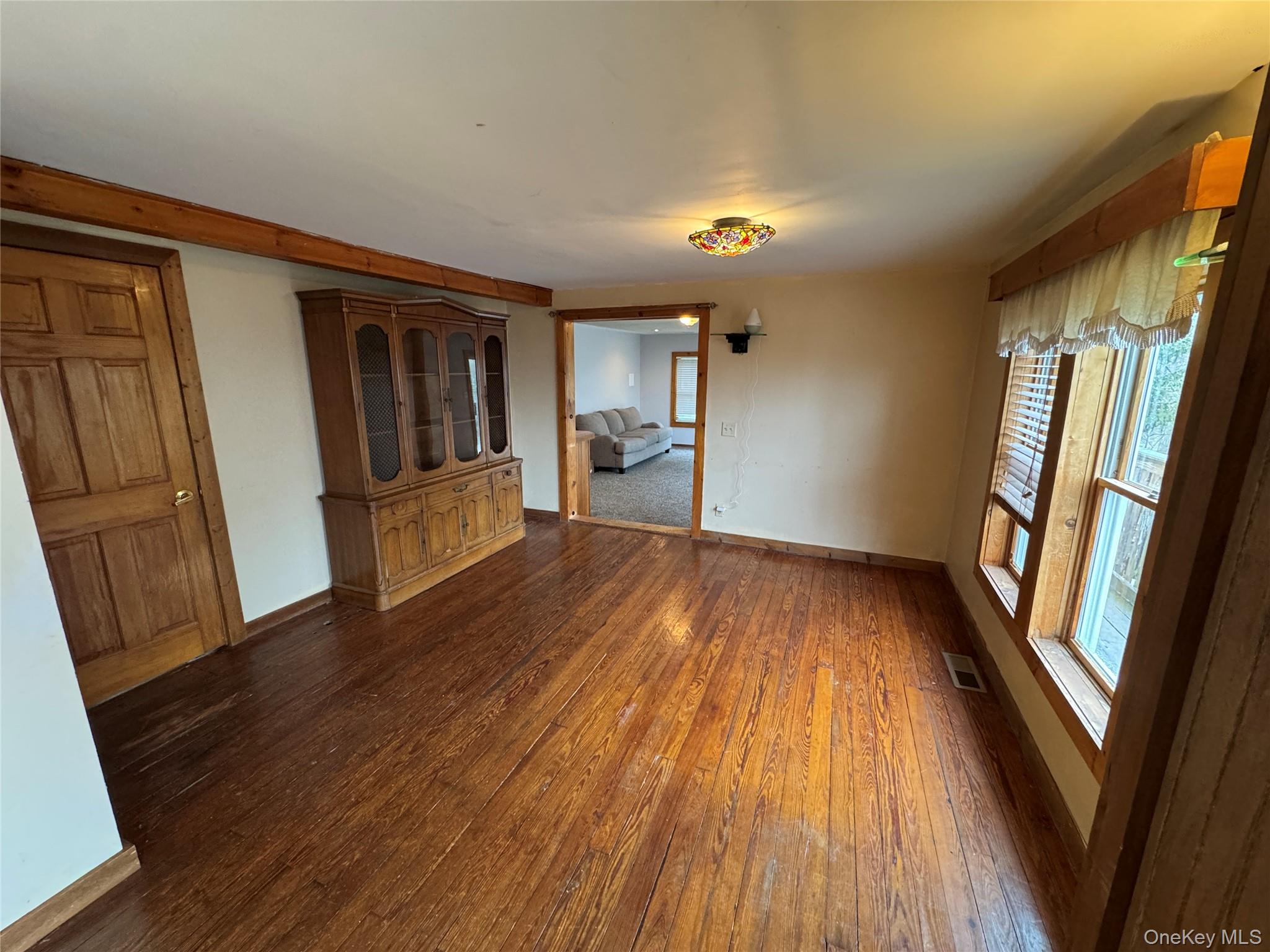 96 White Roe Lake Road Livingston Manor, NY 12758 - Photo 22 of 34 a view of empty room with wooden floor and fan
