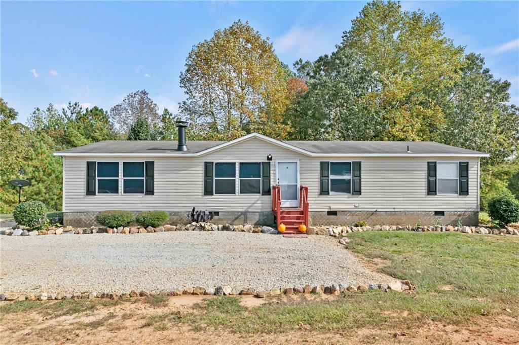 122 Hurst Mill Road Bremen, GA 30110 - Photo 1 of 1 a front view of a house with a patio