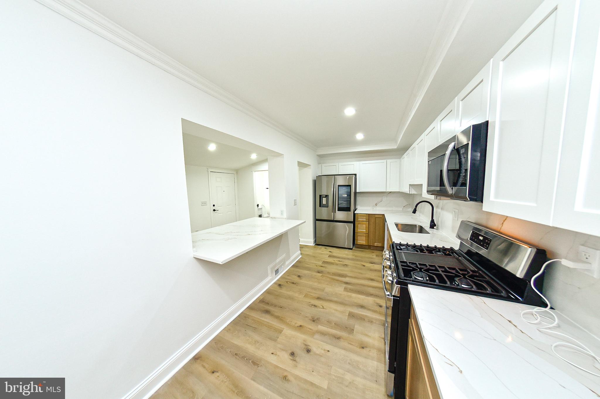 3704 Suitland Road Southeast Washington, DC 20020 - Photo 11 of 70 Modern kitchen with sleek finishes.