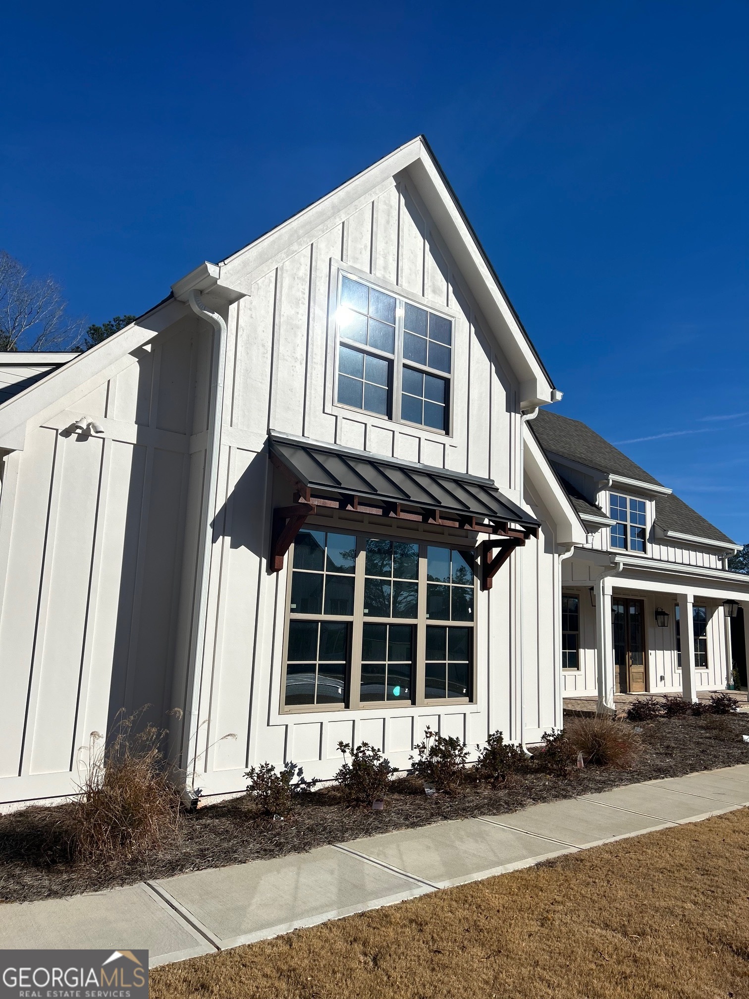 158 Snug Harbor Place Newnan, GA 30263 - Photo 2 of 94 a front view of a house with a yard