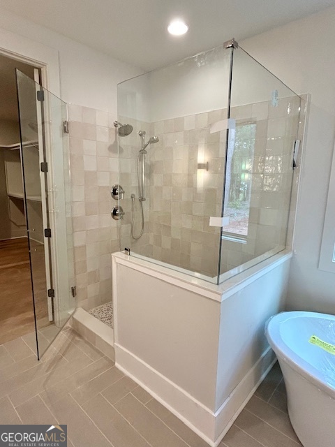 158 Snug Harbor Place Newnan, GA 30263 - Photo 45 of 94 a bathroom with a shower and a bath tub
