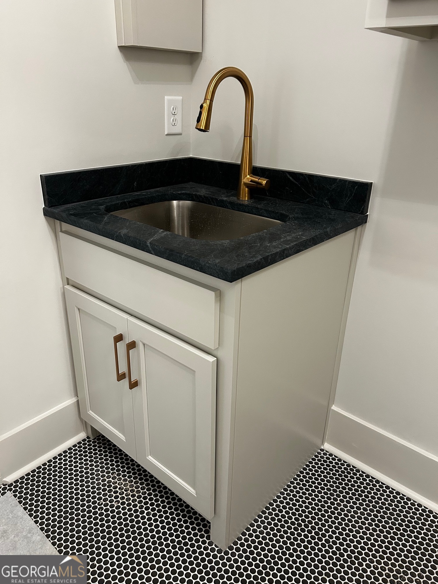 158 Snug Harbor Place Newnan, GA 30263 - Photo 50 of 94 a close view of a sink a mirror and cabinets